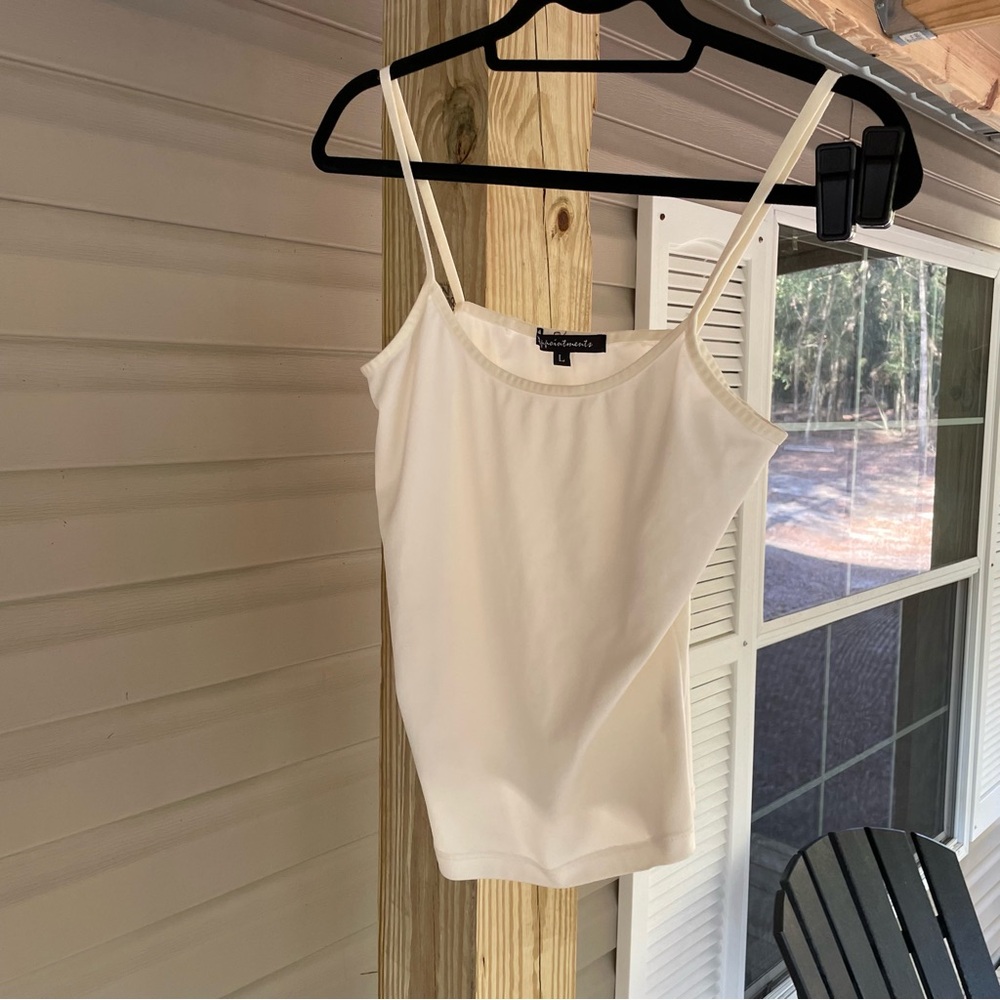 White night tank size L worn with some stains